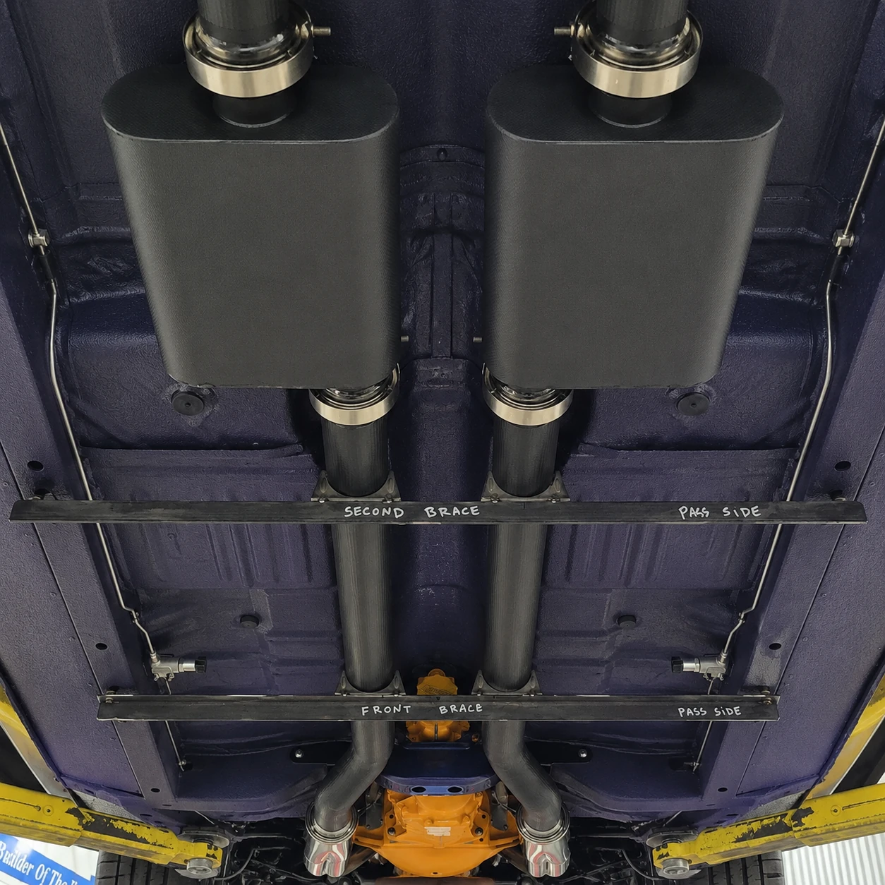 Full underside view of Haraka showing exhaust routing and mufflers